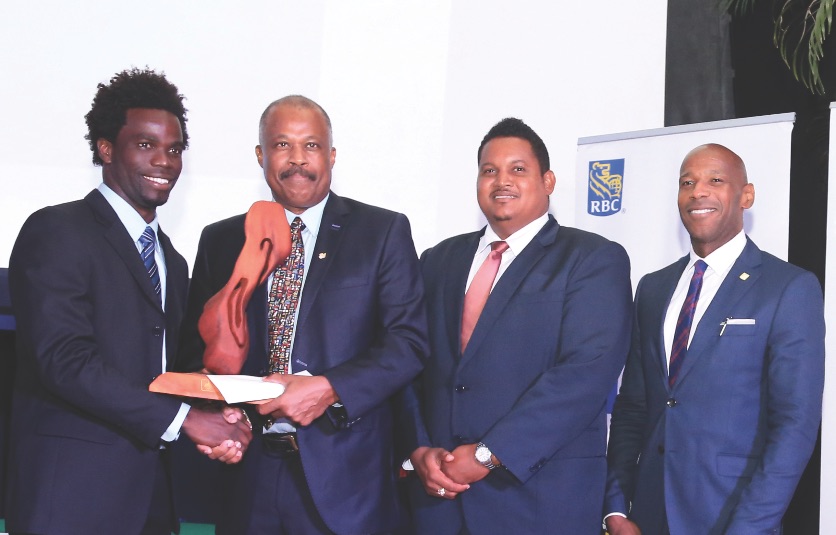 (L-R) UWI Sportsman of the Year 2016, Chadwick Walton, Vice-Chancellor, Professor Sir Hilary Beckles, Trinidad and Tobago Minister of Sport and Youth Affairs, The Honourable Darryl Smith and Managing Director of RBC (which sponsored the event) Mr Darryl White.