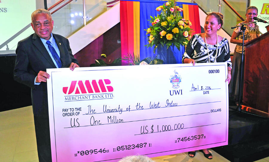JMMB Merchant Bank team leader Donna Duncan Scott (right) presented their cheque for US$1million to Professor Archibald McDonald, Pro Vice-Chancellor and Principal of The University of the West Indies (UWI), Mona (2nd left) for the UWI Global Giving Week at the programme launch at The UWI Regional Headquarters on Friday April 8, 2016. Vice-Chancellor Sir Hilary Beckles, launched the programme aimed at raising resources to fund research, educate and prepare leaders and drive regional development.