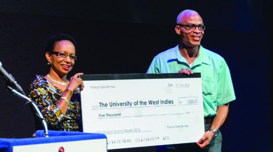 Professor Eudine Barriteau, Pro Vice-Chancellor and Principal, The UWI Cave Hill Campus presents a personal donation of BDS$5,000 at the Cave Hill launch of Giving Week on May 27, 2016.