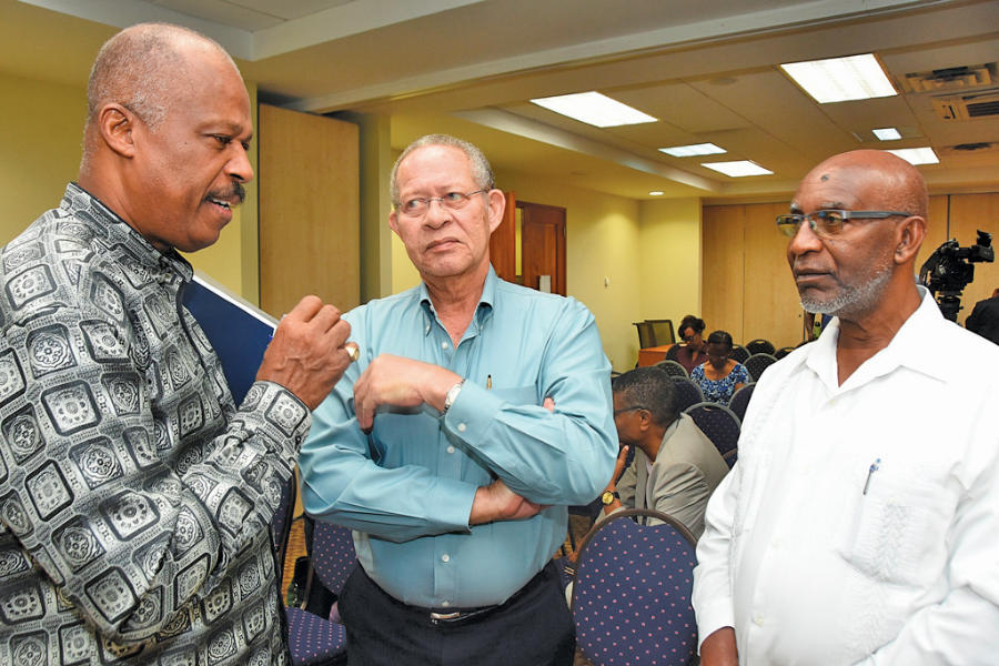 Vice-Chancellor, Professor Sir Hilary Beckles (left), in discussion with former Jamaican Prime Minister, Hon. Bruce Golding (centre), Chair of the 2016 CARICOM/CARIFORUM- relations review commission and former Assistant Secretary General, CARICOM, Ambassador Byron Blake at the Vice- Chancellor's Forum on the Golding Report.